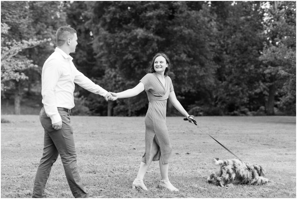 Park engagement photos with a dog on a leash