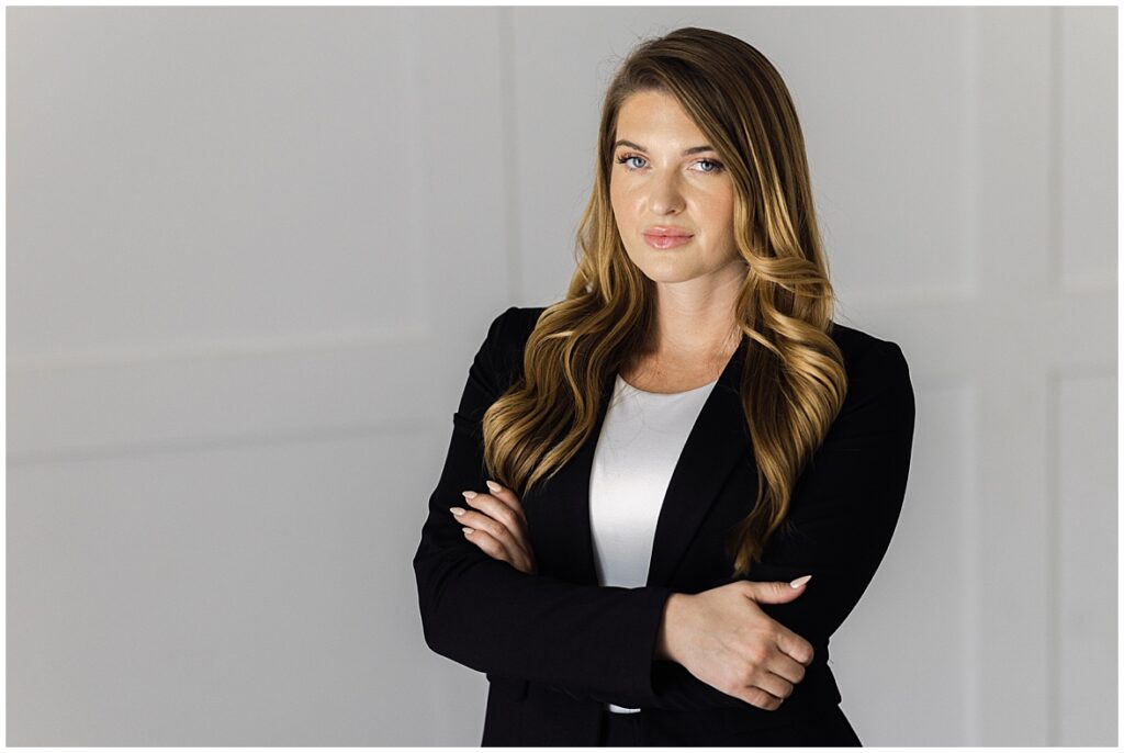 Los Angeles branding photography session of a chic girl in a business suit posing for a portrait with her hands crossed