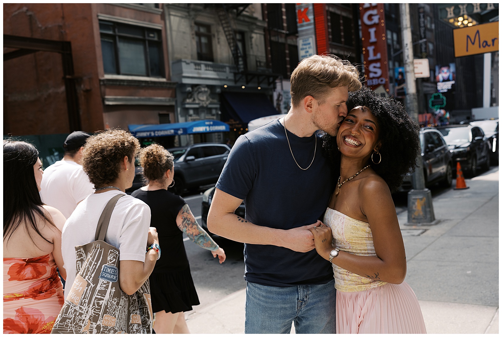 Couple Stop to Embrace in the Middle of Street Traffic in New York City