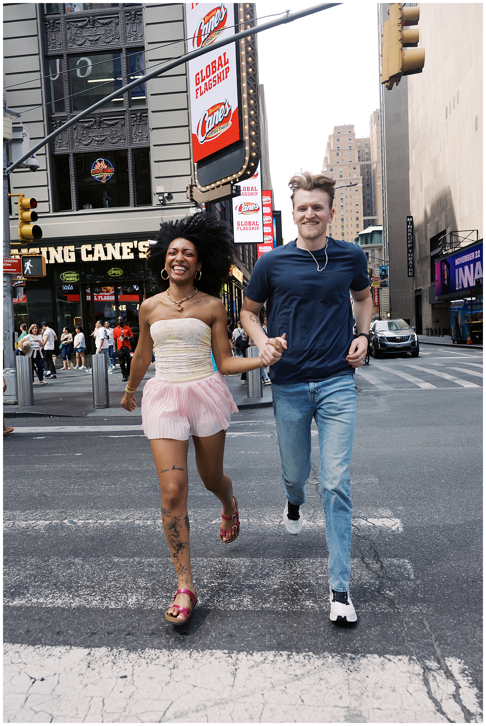 Couple Hold Hands and Run Across Crosswalk in Times Square, NYC