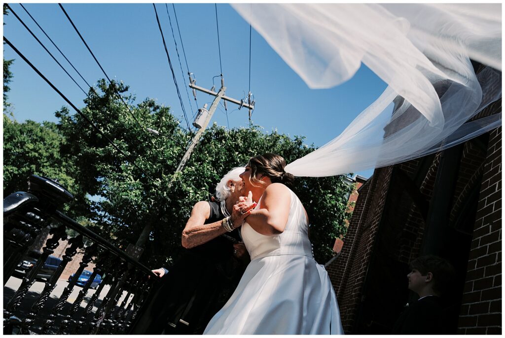 Bride Hugging Grandma During Wedding in Richmond