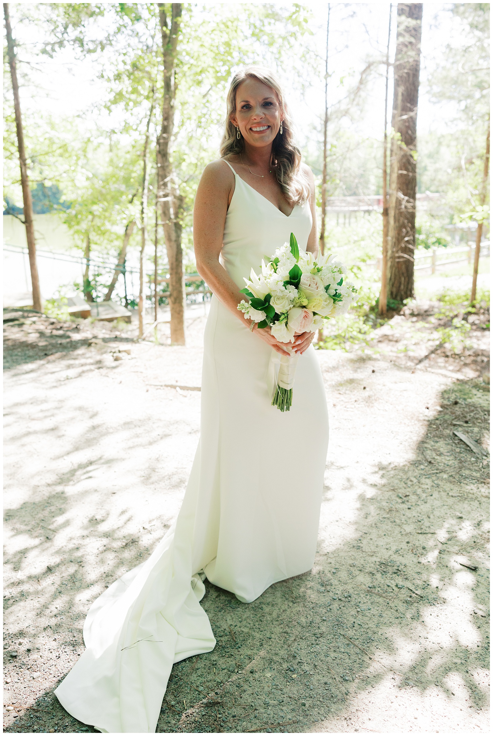 Bride Holding All White Wedding Bouquet, Preparing to Walk Down Aisle at 3 Lakes