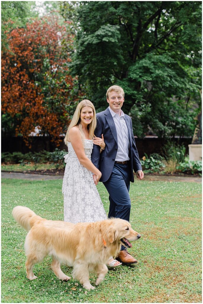 Monument ave engagement session with couple walking with dog at Branch Museum.